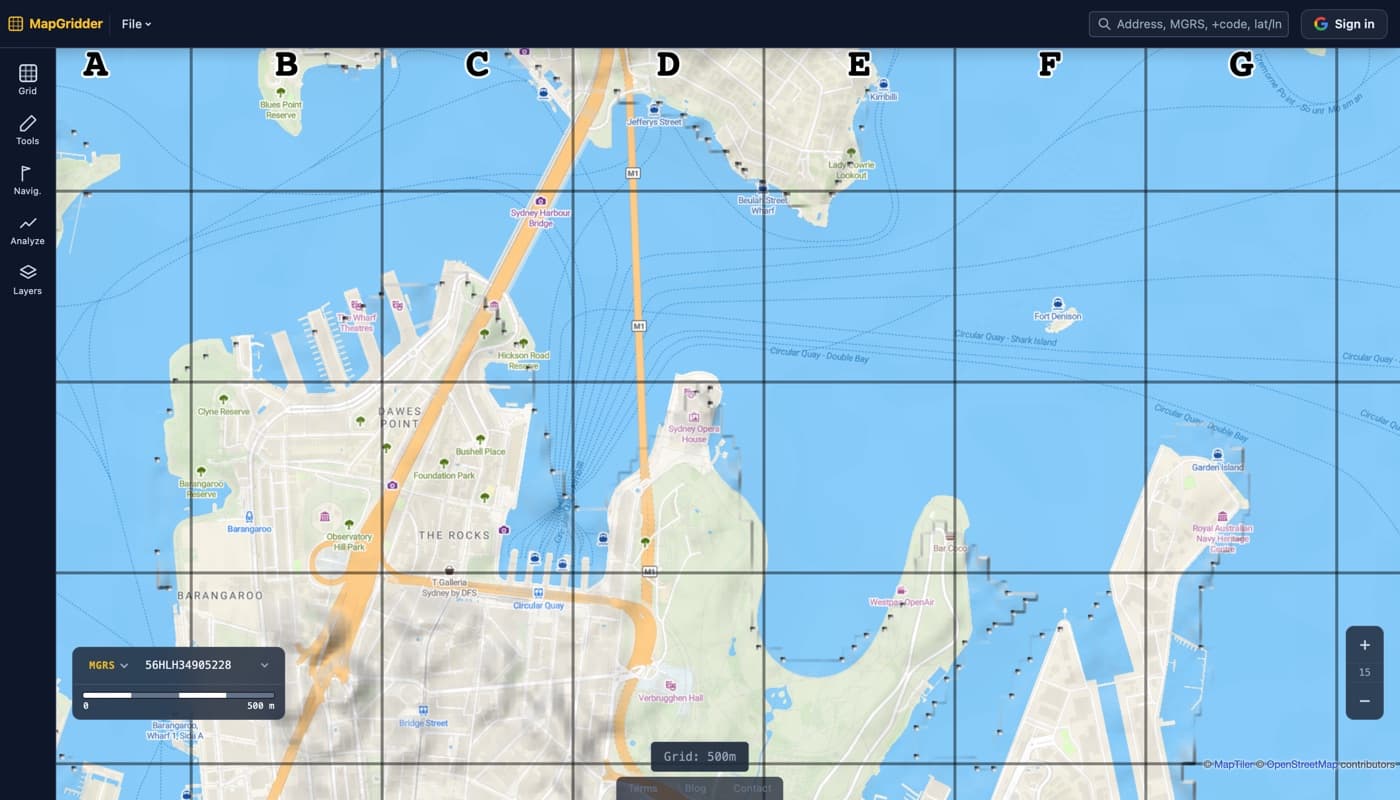 A street map of Sydney Harbour with a bold black 500 meter grid overlaid and column letters A through G labeling the cells, with no watermark anywhere on the map.