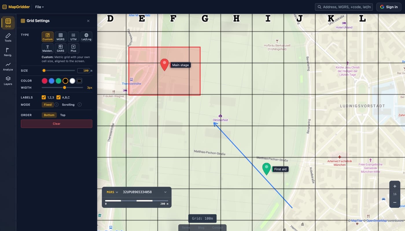 The MapGridder grid panel open beside an event grounds map with a bold 100 meter labeled grid, a red zone rectangle marked Main stage, a First aid waypoint pin, and a blue arrow showing an approach path.